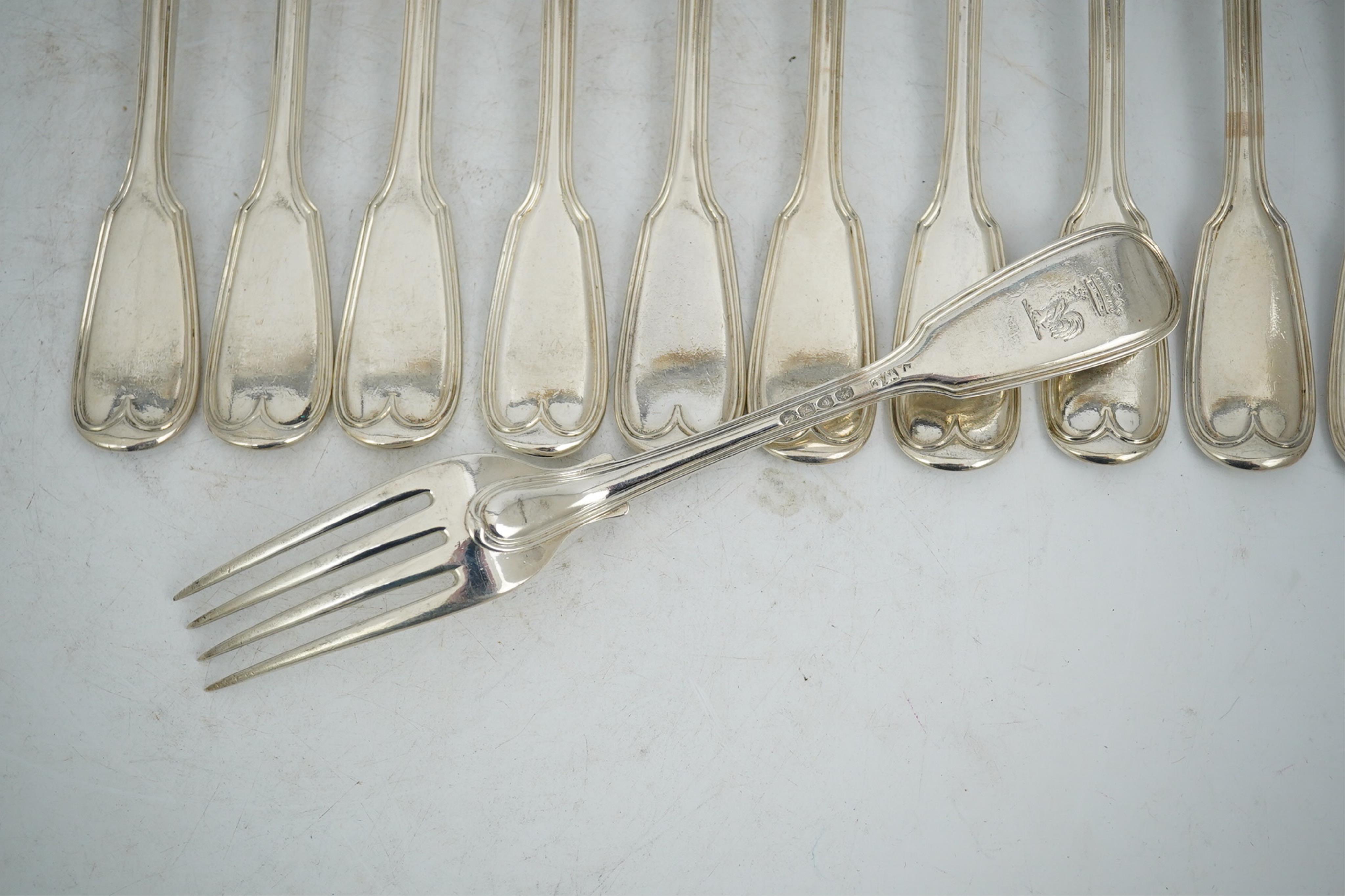 A set of twelve William IV silver double struck fiddle and thread pattern table forks, William Chawner II, London, 1831, 34.2oz.